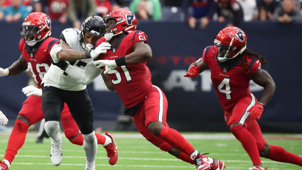 Texans defensive end Will Anderson Jr. is blocked by Jacksonville Jaguars tight end Evan Engram (17) in the second half at NRG Stadium